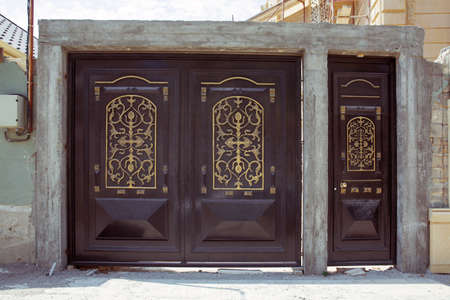 Automatic Electric Roll-up Gate Or Push-up Door In The Modern Building Ground Floor . Shutter door or roller door and concrete floor outside . Black Automatic shutters in a house . gates in the garageの写真素材