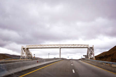 The pedestrian crossing bridge . Bridges crossing people without a roof. Open road with blue clouds .の写真素材