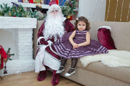 Baku, Azerbaijan . 26.01.2020 . New Year celebration in Azerbaijan kindergarten with Ded Moroz (Grandfather Frost) . The child takes a photo with Santa Claus.のeditorial素材