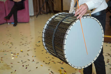 Man plays big drum . Musicians march, play and make music with large bass drums . Drummer performance musicians play the tacked head Drum .の写真素材