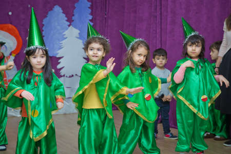 Baku, Azerbaijan . 26.01.2020 . The children are green dressed as pinocchio . Kindergarten participants take part in a New Year's event. Kids dressed in festive green costumes of participantsのeditorial素材