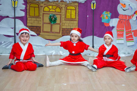 Baku, Azerbaijan . 26.01.2020 . The children are dressed as red Santa Claus. Kindergarten participants take part in a New Year's event. Cute boys dressed in festive costumes of red Santa Clausのeditorial素材