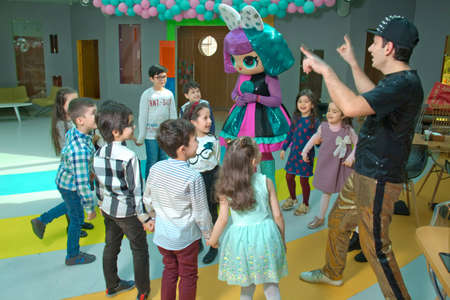 Baku, Azerbaijan. 02.04.2019 . Children's birthday party with Lol animators. Happy group of children at a birthday celebration dressed in the style of Lol with an animator .のeditorial素材