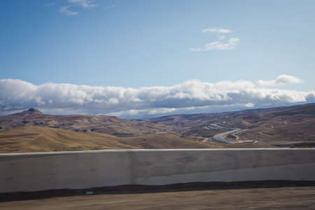 Big yellow sand, desert and blue sky. Nature . desert-mountainous terrain . Blue sky with many white...
