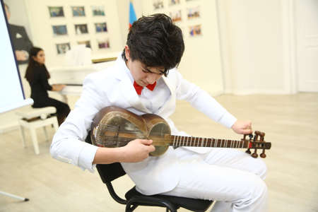 Azerbaijan Baku . 21.02.2020. Tar string instrument . Man playing on a classical folk instrument tar...