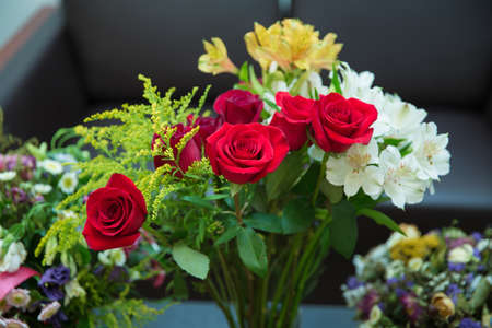 Blooming red roses flower over blured hexagon bokeh background. Valentines Day background, wedding...