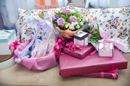 Red gift box. Closed with red ribbon. Red gift box with red ribbon, blur office desk background . Rosa Mainzer Fastnacht . Pink gift basketの写真素材