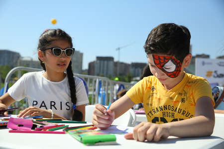 BAKU, AZERBAIJAN - JUNE 1 2019 : Kids festival . In park of Heydar Aliyev Center. Children paintingのeditorial素材