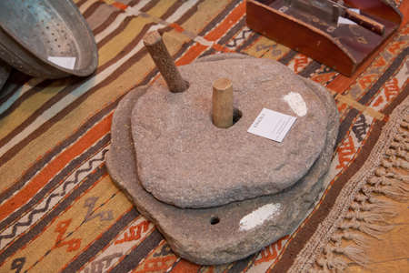 Azerbaijan Baku 04.12.2020 . Rotary discoid mill stone for hand-grinding a grain into flour....