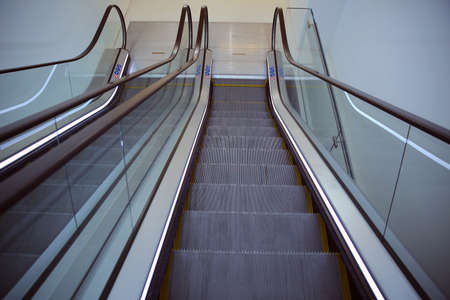 Modern escalator electronic system moving. Moving escalator in the business center of a cityの写真素材