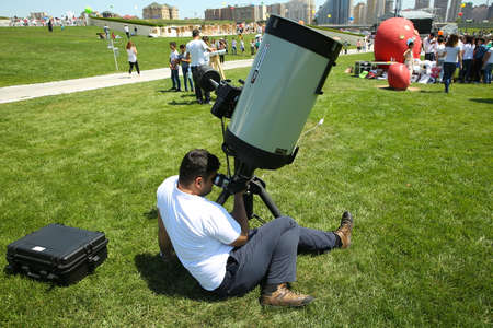 BAKU, AZERBAIJAN - JUNE 1 2019 : Kids festival . In park of Heydar Aliyev Center. Preparations are underway to look at planetsのeditorial素材