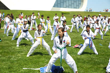 BAKU, AZERBAIJAN - JUNE 1 2019 : Kids festival . In park of Heydar Aliyev Center. Kids show a karate show at the festivalのeditorial素材