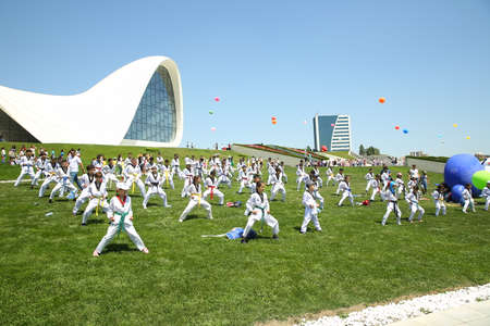 BAKU, AZERBAIJAN - JUNE 1 2019 : Kids festival . In park of Heydar Aliyev Center. Kids show a karate show at the festivalのeditorial素材