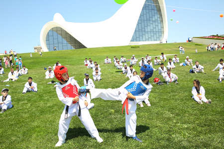 BAKU, AZERBAIJAN - JUNE 1 2019 : Kids festival . In park of Heydar Aliyev Center. Kids show a karate show at the festivalのeditorial素材
