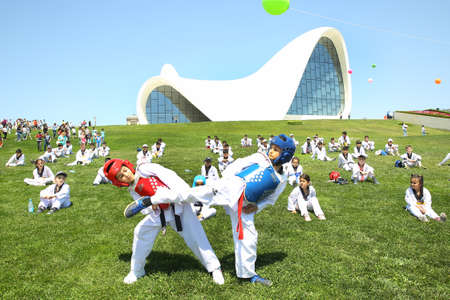BAKU, AZERBAIJAN - JUNE 1 2019 : Kids festival . In park of Heydar Aliyev Center. Kids show a karate show at the festivalのeditorial素材