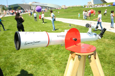 BAKU, AZERBAIJAN - JUNE 1 2019 : Kids festival . In park of Heydar Aliyev Center. BRESSER Messier AR-90 900 NANO AZ Telescopeのeditorial素材