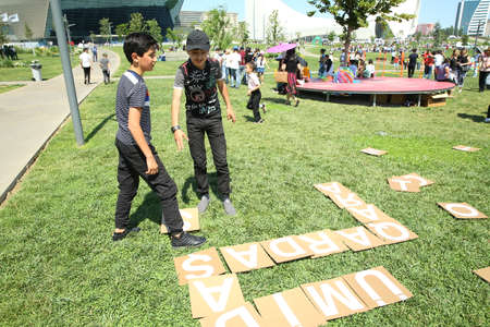 BAKU, AZERBAIJAN - JUNE 1 2019 : Kids festival . In park of Heydar Aliyev Center. Kids play games