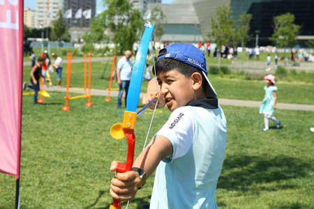 BAKU, AZERBAIJAN - JUNE 1 2019 : Kids festival . In park of Heydar Aliyev Center. Children throw balsのeditorial素材