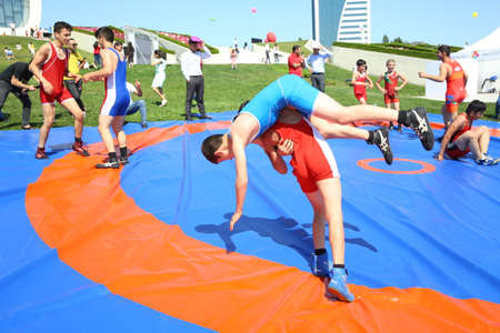 BAKU, AZERBAIJAN - JUNE 1 2019 : Kids festival . In park of Heydar Aliyev Center. Children show the Wrestling Showのeditorial素材