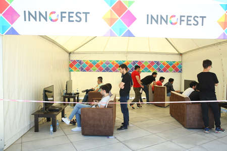 BAKU, AZERBAIJAN - JUNE 1 2019 : Kids festival . In park of Heydar Aliyev Center. children playing play stationのeditorial素材