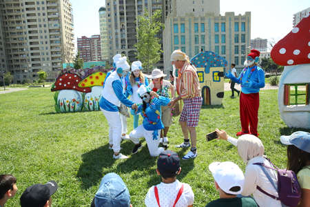 BAKU, AZERBAIJAN - JUNE 1 2019 : Kids festival . In park of Heydar Aliyev Center. The children look at the theater of fairy tale heroes . Sweetのeditorial素材