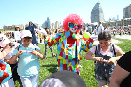 BAKU, AZERBAIJAN - JUNE 1 2019 : Kids festival . In park of Heydar Aliyev Center. Clowns hold shows for children'sのeditorial素材