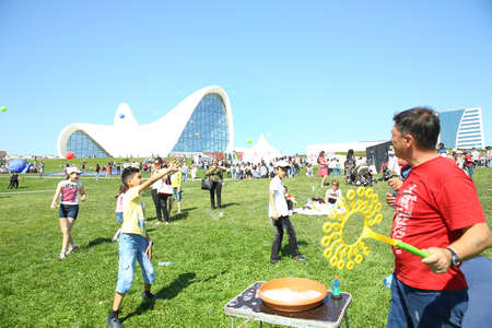 BAKU, AZERBAIJAN - JUNE 1 2019 : Kids festival . In park of Heydar Aliyev Center. Soap bubbles show. Gomel Children's Center.Children at the feast. Soap bubbles show. Children's party.のeditorial素材