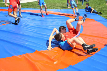 BAKU, AZERBAIJAN - JUNE 1 2019 : Kids festival . In park of Heydar Aliyev Center. Children show the Wrestling Showのeditorial素材