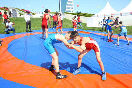 BAKU, AZERBAIJAN - JUNE 1 2019 : Kids festival . In park of Heydar Aliyev Center. Children show the Wrestling Showのeditorial素材
