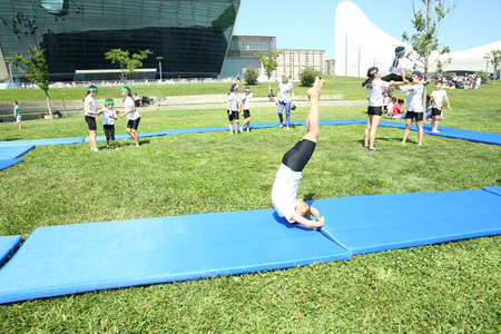 BAKU, AZERBAIJAN - JUNE 1 2019 : Kids festival . In park of Heydar Aliyev Center. Children show gymnastics showのeditorial素材
