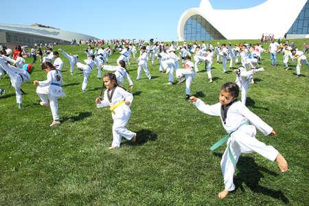 BAKU, AZERBAIJAN - JUNE 1 2019 : Kids festival . In park of Heydar Aliyev Center. Kids show a karate show at the festivalのeditorial素材