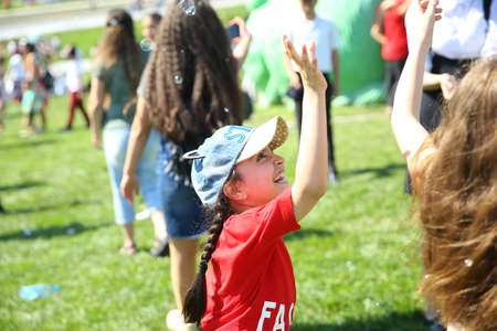 BAKU, AZERBAIJAN - JUNE 1 2019 : Kids festival . In park of Heydar Aliyev Center. Soap bubbles show. Gomel Children's Center.Children at the feast. Soap bubbles show. Children's party.のeditorial素材