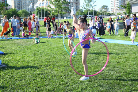 BAKU, AZERBAIJAN - JUNE 1 2019 : Kids festival . In park of Heydar Aliyev Center. Children show gymnastics showのeditorial素材