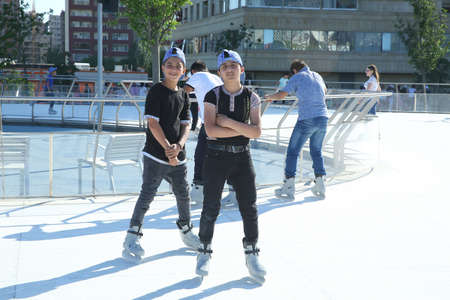 BAKU, AZERBAIJAN - JUNE 1 2019 : Kids festival . In park of Heydar Aliyev Center. Children slip on the iceのeditorial素材