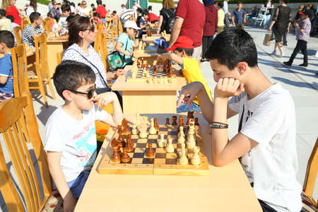BAKU, AZERBAIJAN - JUNE 1 2019 : Kids festival . In park of Heydar Aliyev Center. Children play chessのeditorial素材