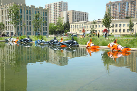 BAKU, AZERBAIJAN - JUNE 1 2019 : Kids festival . Heydar Aliyev Center. Children play . Kids Inflatable The fish Pool Floats Buoy Swimming Air Mattress Floating Island Toy Water Boat Pontoon Summer Funのeditorial素材
