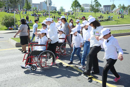 BAKU, AZERBAIJAN - JUNE 1 2019 : Kids festival . In park of Heydar Aliyev Center. Disabled children come to the festivalのeditorial素材