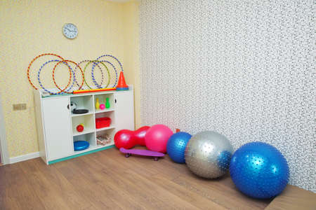 Azerbaycan Baku 21.09.2018 . Gym room in kindergarten . sports gym . Indoor play area . Large bouncy spiky ball . Gym Yoga Balls . White wardrobe. gymnastic instrumentsのeditorial素材