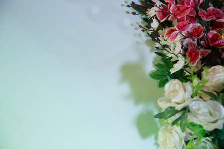 Garland of Large White Roses . Roses Garland Artificial Silk Flowers . Seamless border with white roses. Isolated on white background. Free space for writing. Red orchids flowers .の写真素材