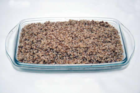Buckwheat in a glass bowl. Raw buckwheat porridge.の写真素材