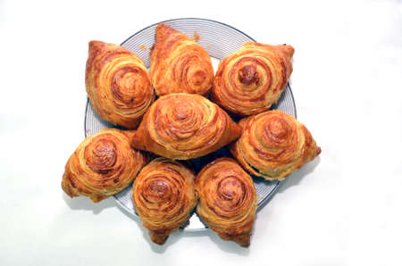 Azerbaijani dessert badambura on the white plate background . Badambura or almond tube is a type of...