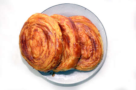 Fresh pastries Gogal isolated on white background. Gogal Traditional Azerbaijani Cookie on Novruz Easter . Novruz holiday with Azerbaijan national pastry Gogal and glassの写真素材