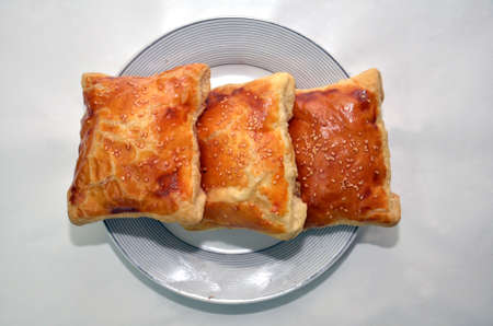 khachapuri layered Azerbaijan kitchen white backgrounds .Rectangular khachapuri in a white plate . Khachapuri. Georgian national pie khachapuri with egg and cheese in the white plate .の写真素材