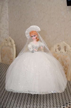 Azerbaijan Baku . 14.04.2015 . Doll in a white wedding dress . Decorative doll with a white wedding dress . Decorative wedding ornament. Illustrative editorial. The doll is in a white dressのeditorial素材
