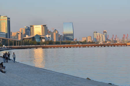 Baku, Azerbaijan 07.10.2011 . Baky skyline view from Baku boulevard the Caspian Sea embankment . Tall buildings in Baku. Ship cranes . Moon Baku Business Centerのeditorial素材