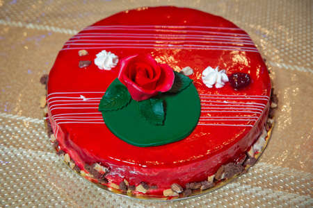 Red flowers on the cake . Red rose on the cake . Red round cake.の写真素材