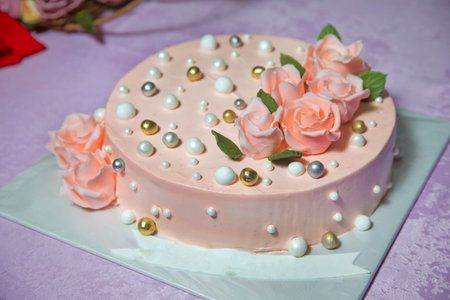 Orange golden rose . Round ball decorated like a round pearl . Peach round cake.の写真素材
