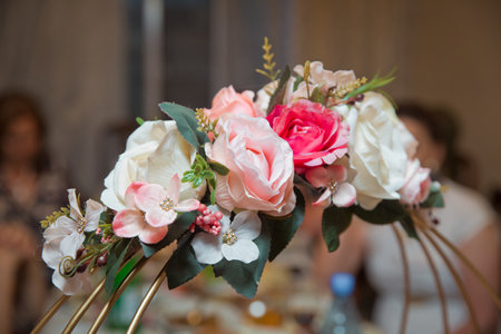 colorful flowers in a basket . Engagement flowers basket . The handle of the engagement basket . There are candies in the basket decoration . Artificial flowers .の写真素材