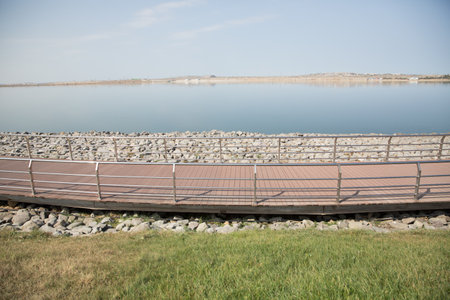 An oval bridge from iron and wood on the edge of the lake . Boyukshor Lake in Baku Azerbaijan . According to geological data, the average depth of the water in the lake is 3.40-3.95 meters .の写真素材