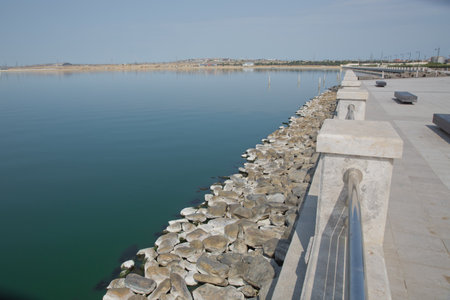 An oval bridge from iron and wood on the edge of the lake . Boyukshor Lake in Baku Azerbaijan . According to geological data, the average depth of the water in the lake is 3.40-3.95 meters .の写真素材